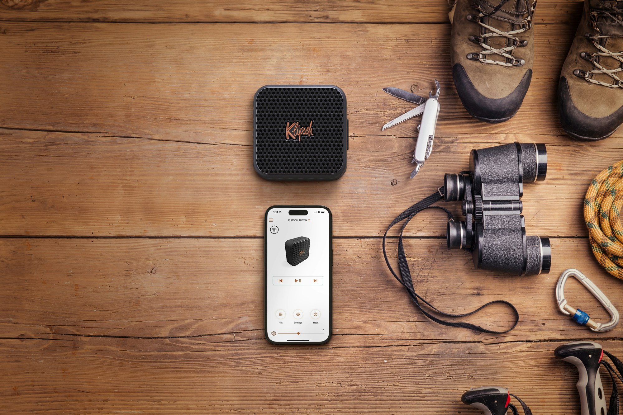 Klipsch Austin flatlay on wooden table with hiking gear 2000x1333